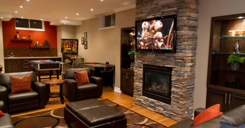 Image of a renovated basement with a fireplace