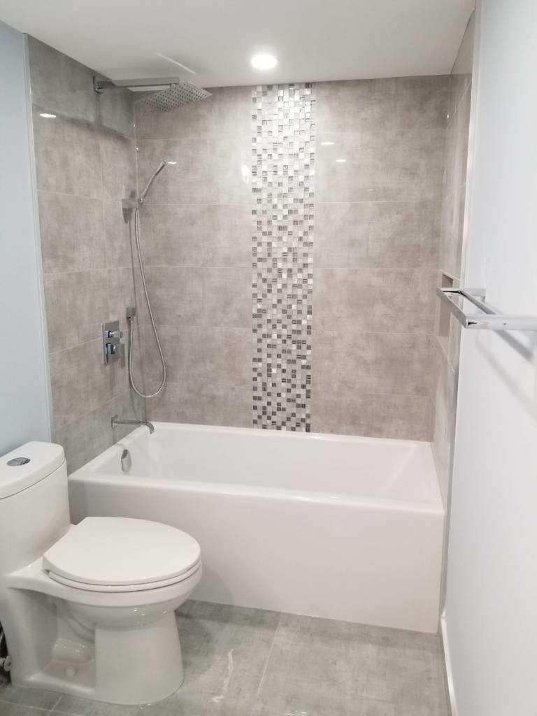 custom bathtub with marble wall decor - bathroom renovation contractors toronto